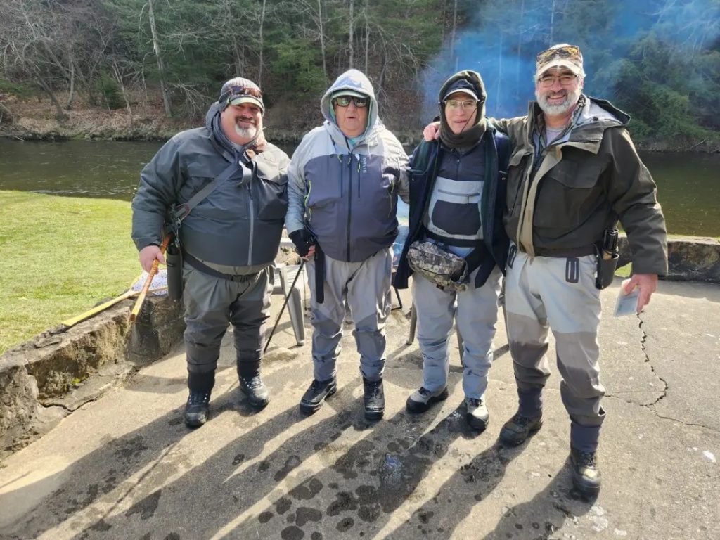 Dan, Jim, Tom, and Chris, alongside the Neshannock.