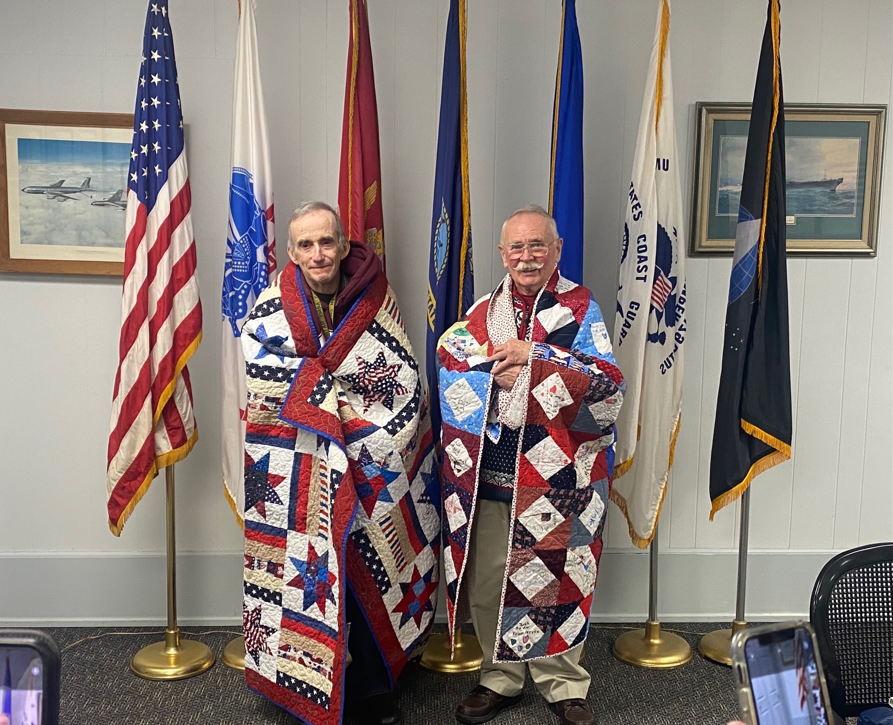 Pete and Dennis proudly wearing their Quilts of Valor